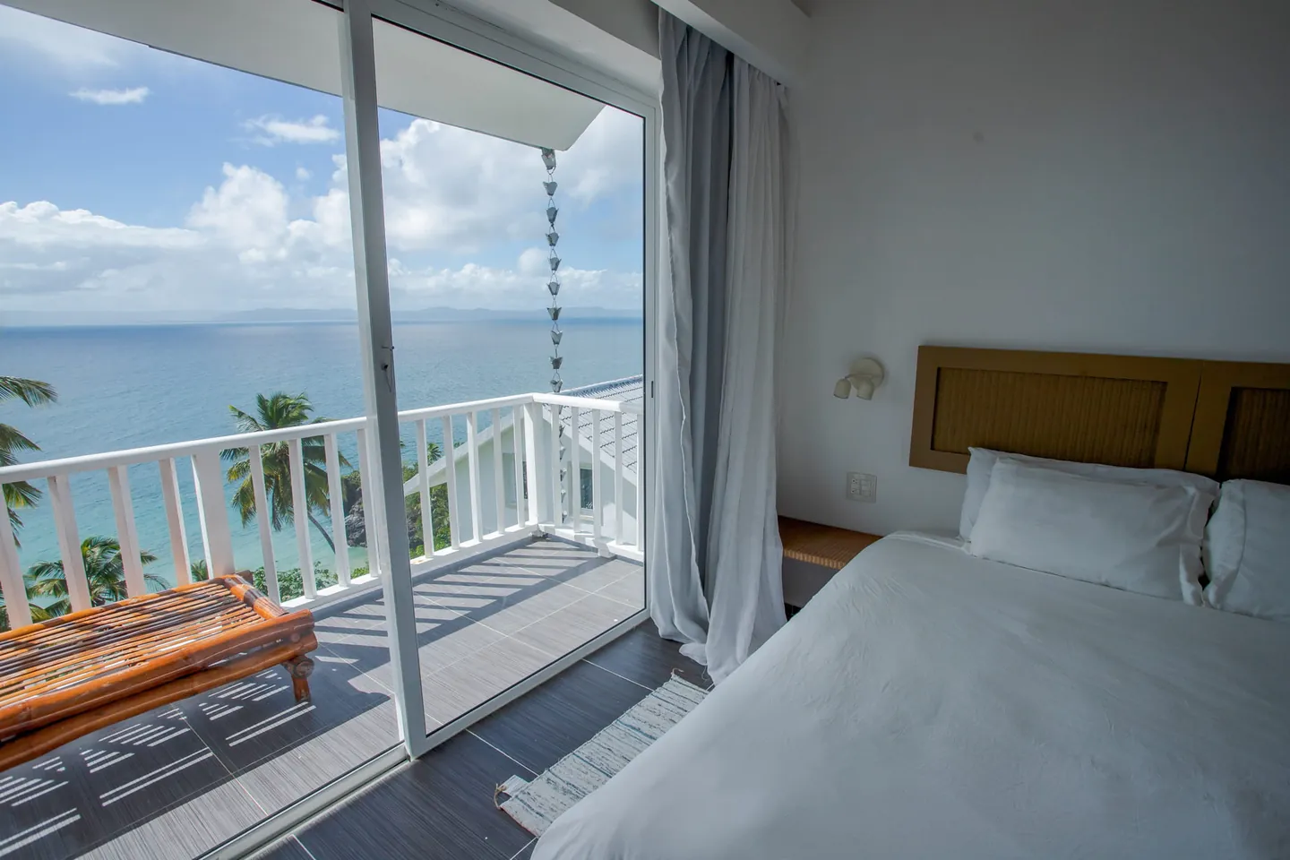 Bedroom with the balcony open to the bay